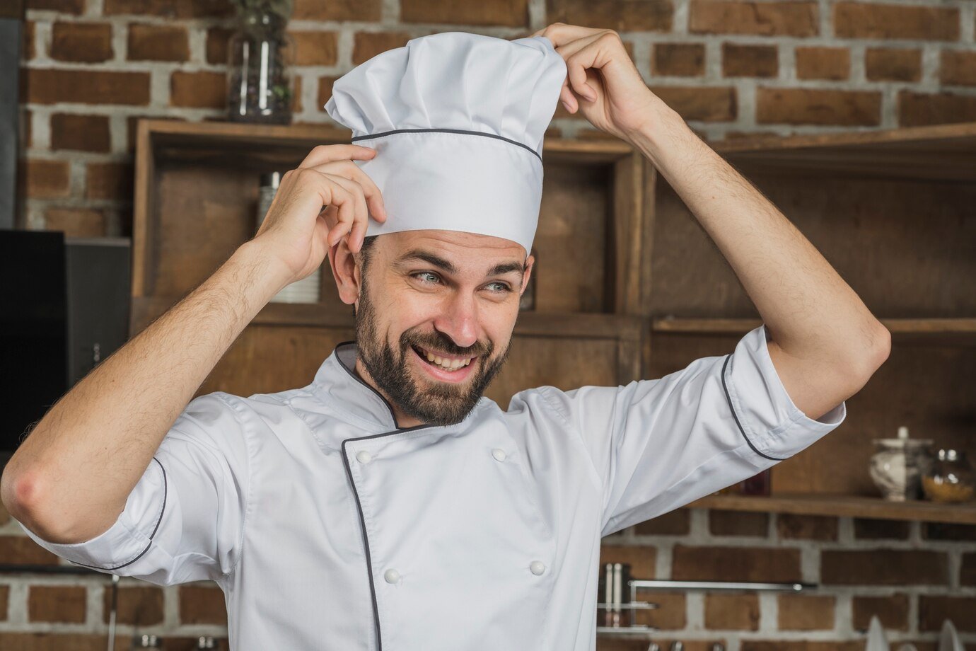 Curtis James 1 Curtis adjusting his chef hat and smiling confidently
