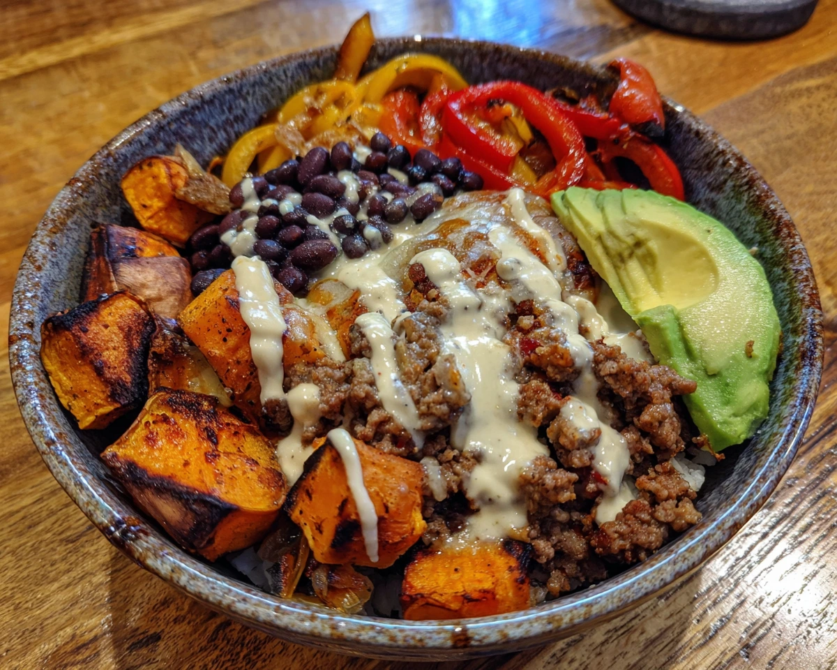 High protein taco bowl with beef, sweet potatoes, and beans